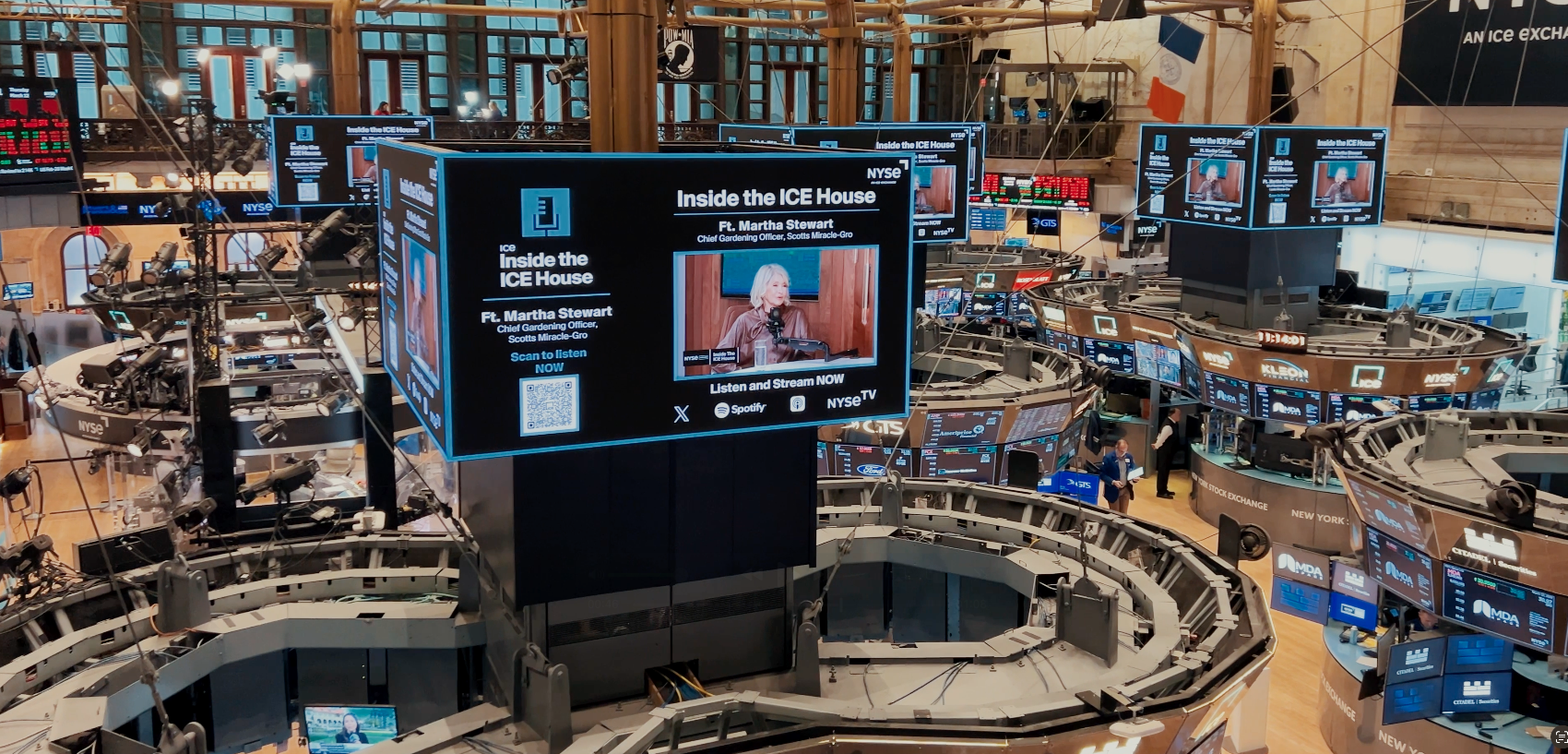 Trading floor at the New York Stock Exchange with active market displays and staff working during a regular trading day.